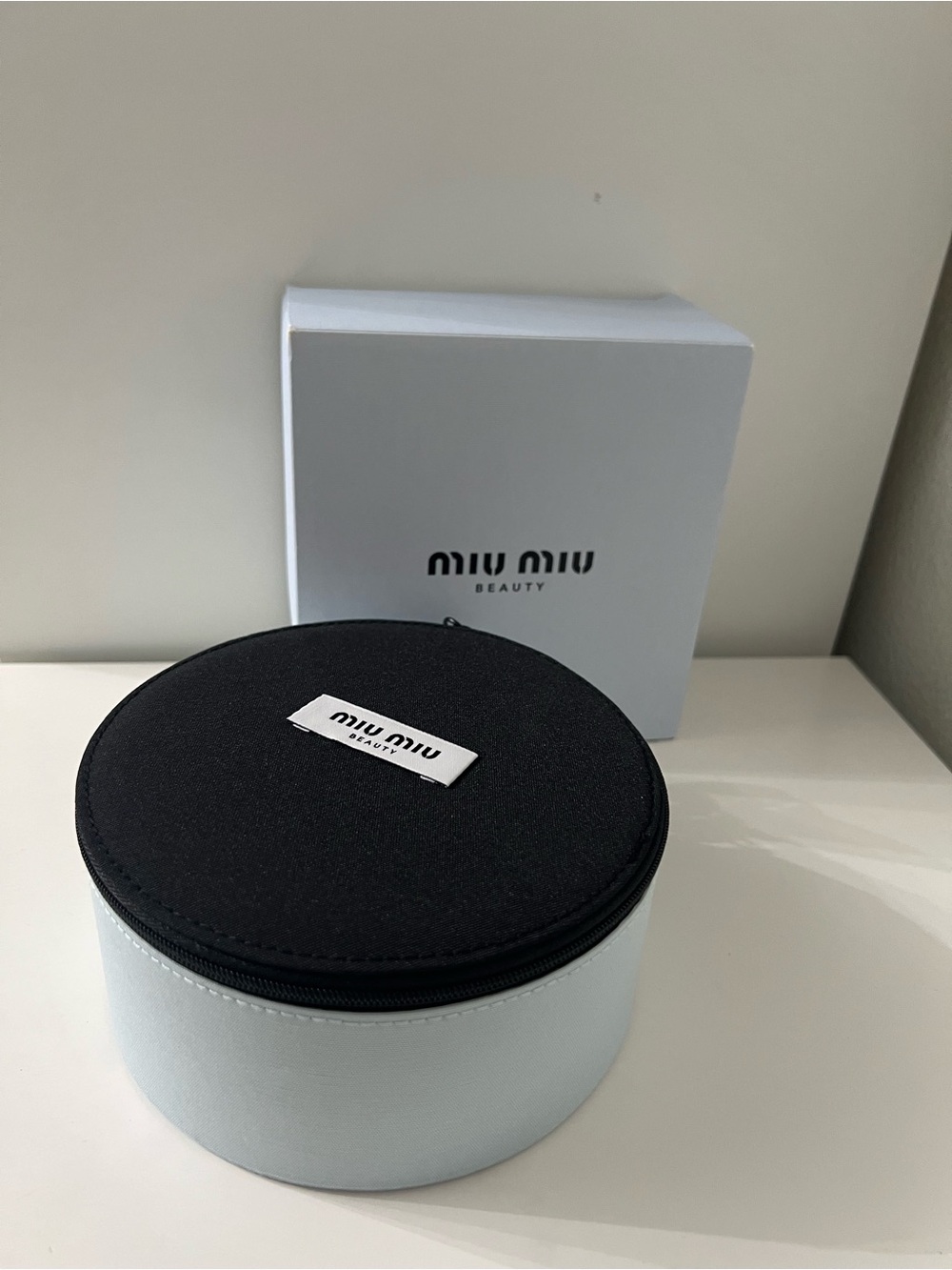 Miu Miu beauty Black and Light Blue Round Travel Case